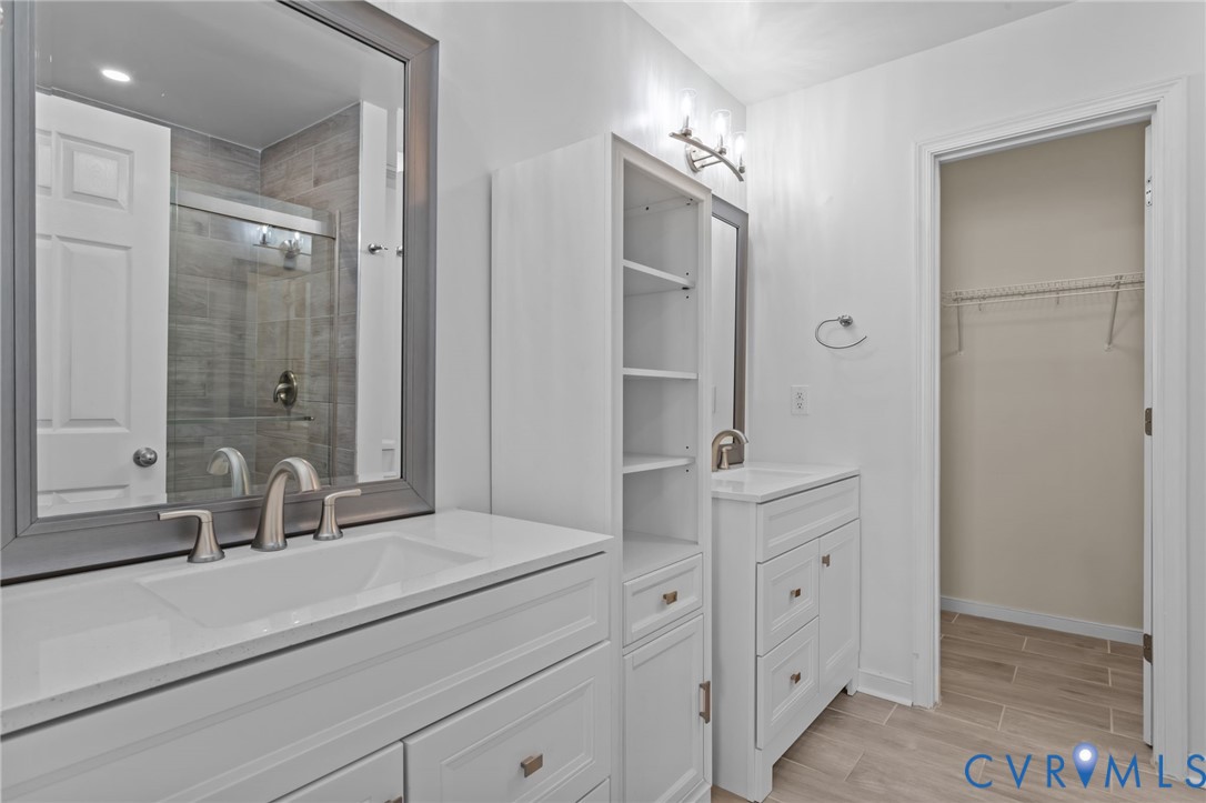 6106 Lookout Point Circle Midlothian, VA 23112 - Photo 24 of 42 a bathroom with a double vanity sink mirror and shower