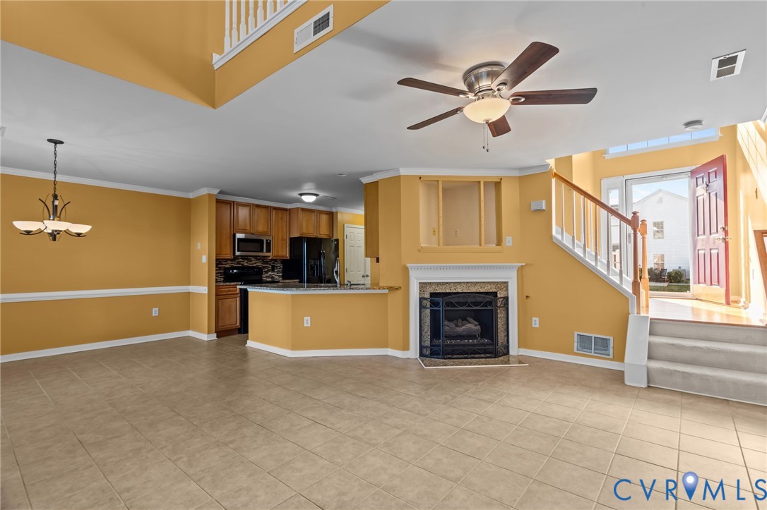 6106 Lookout Point Circle Midlothian, VA 23112 - Photo 5 of 42 a view of a livingroom with a ceiling fan a fireplace and a ceiling fan