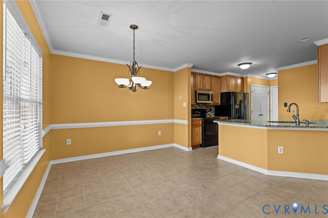 6106 Lookout Point Circle Midlothian, VA 23112 - Photo 8 of 42 a view of a kitchen with a sink and dishwasher a refrigerator with wooden floor