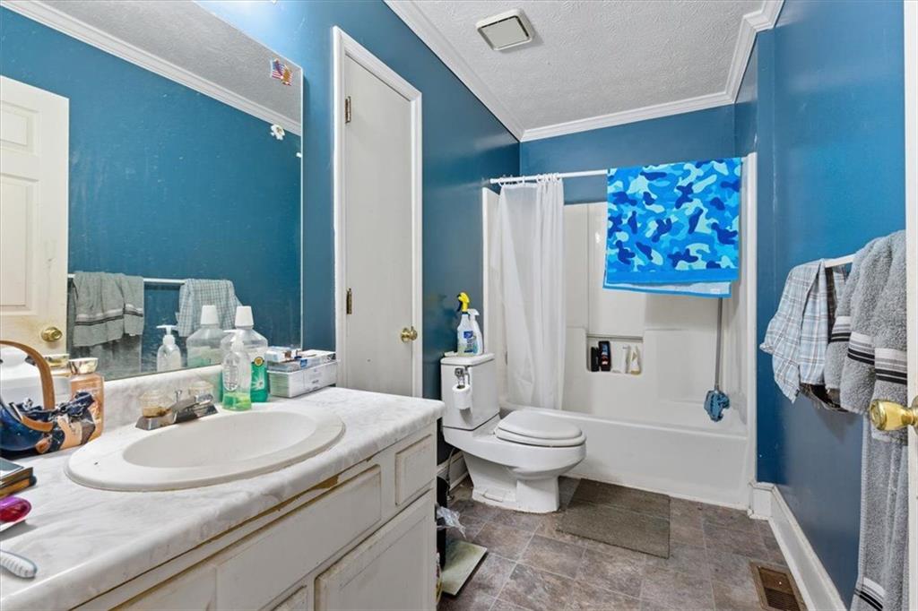 31 Powder Mill Drive Dallas, GA 30157 - Photo 12 of 41 a bathroom with a sink toilet and shower