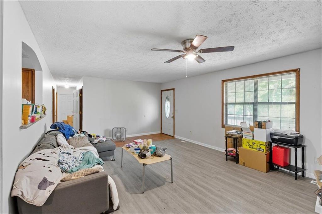 31 Powder Mill Drive Dallas, GA 30157 - Photo 15 of 41 a living room with furniture fireplace and flat screen tv
