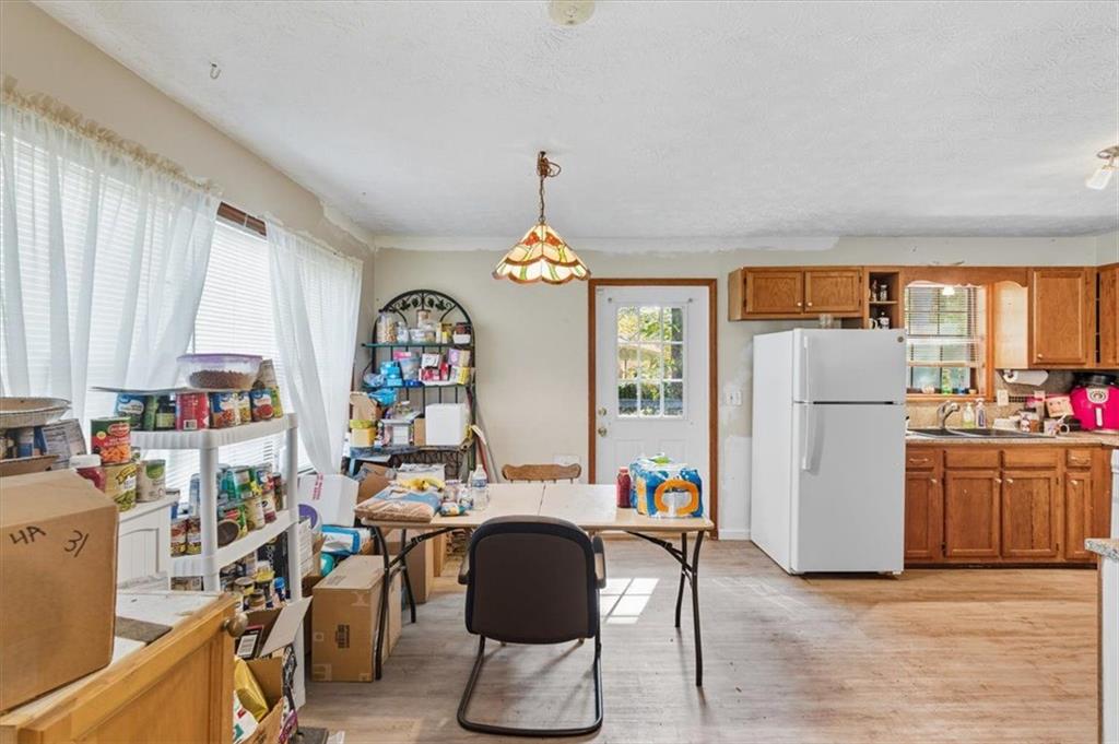 31 Powder Mill Drive Dallas, GA 30157 - Photo 16 of 41 a workspace room with furniture and a chandelier