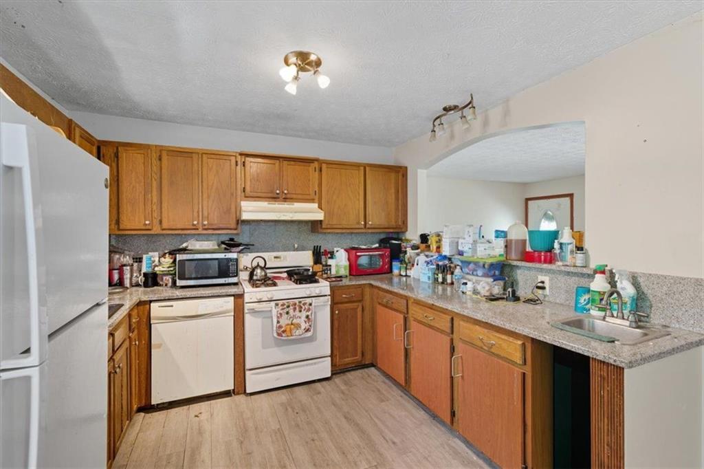 31 Powder Mill Drive Dallas, GA 30157 - Photo 18 of 41 a kitchen with a sink stove and cabinets