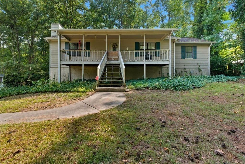 31 Powder Mill Drive Dallas, GA 30157 - Photo 2 of 41 a front view of a house with a yard and trees