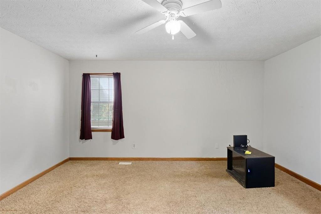 31 Powder Mill Drive Dallas, GA 30157 - Photo 22 of 41 a room with a window and a chandelier fan