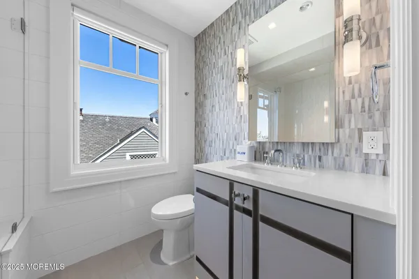 a view of a lake with tall buildings