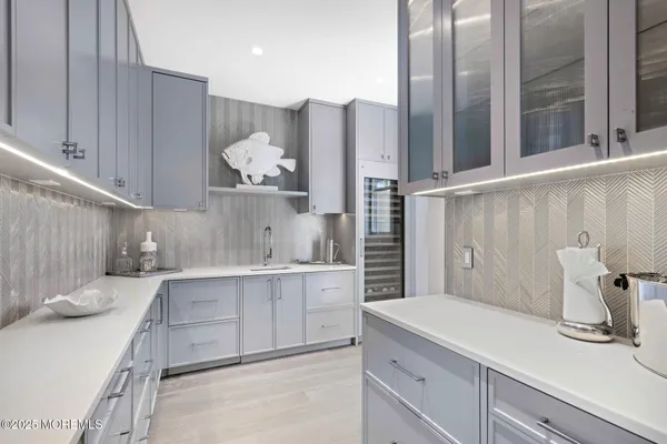 a kitchen with a sink and cabinets