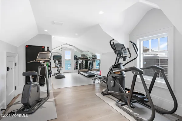 a view of staircase with white walls and windows