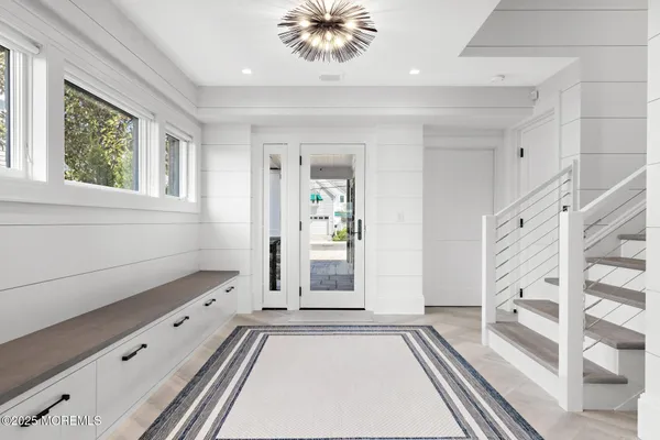 a view of a dining room with furniture wooden floor and garden view
