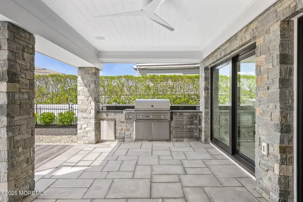 a view of a pathway that has flowers in front of house