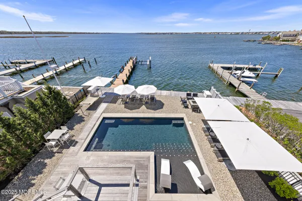 an aerial view of a house with a ocean view