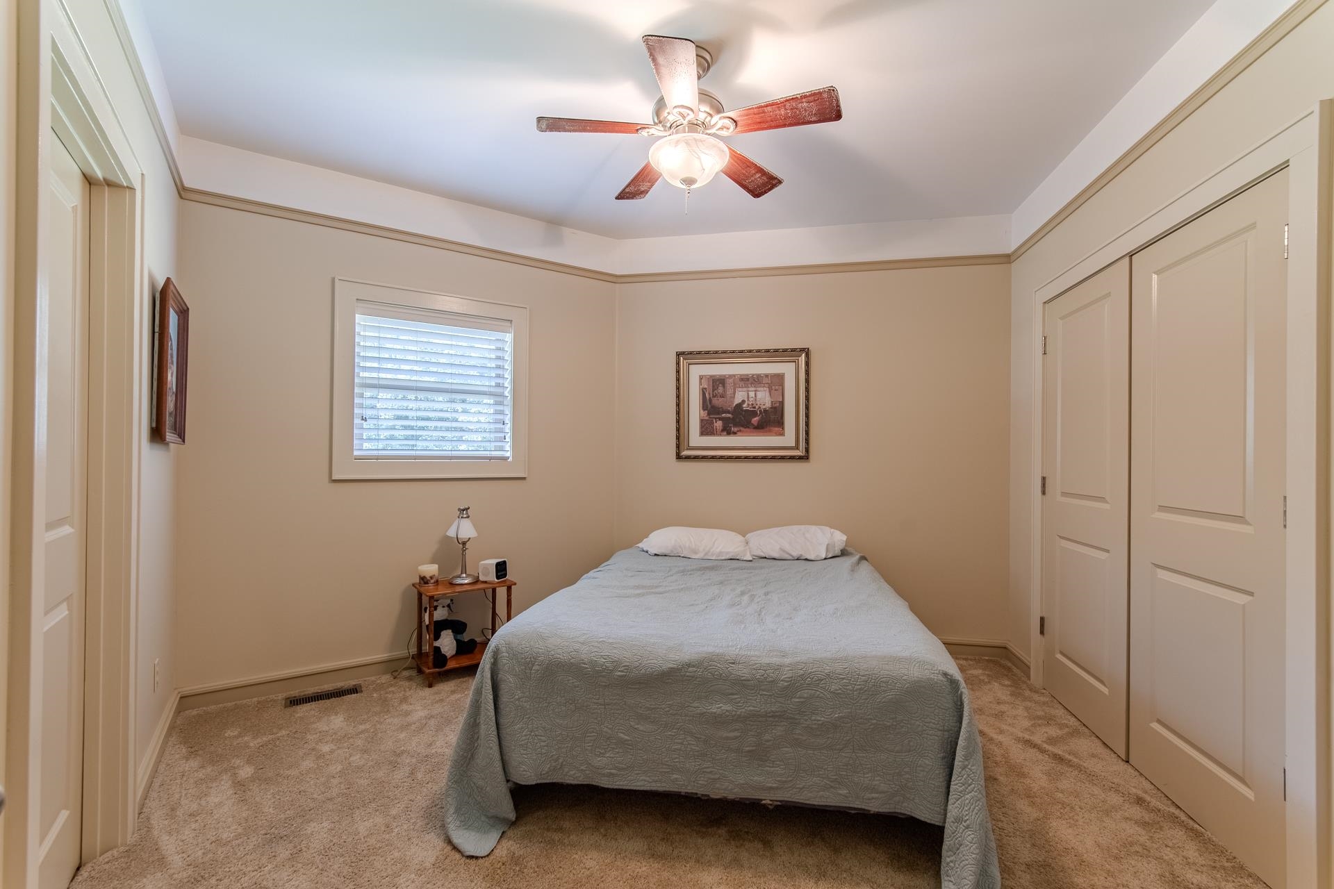 2690 Fellowship Road Sardis, TN 38371 - Photo 28 of 39 a bedroom with a bed and a chandelier