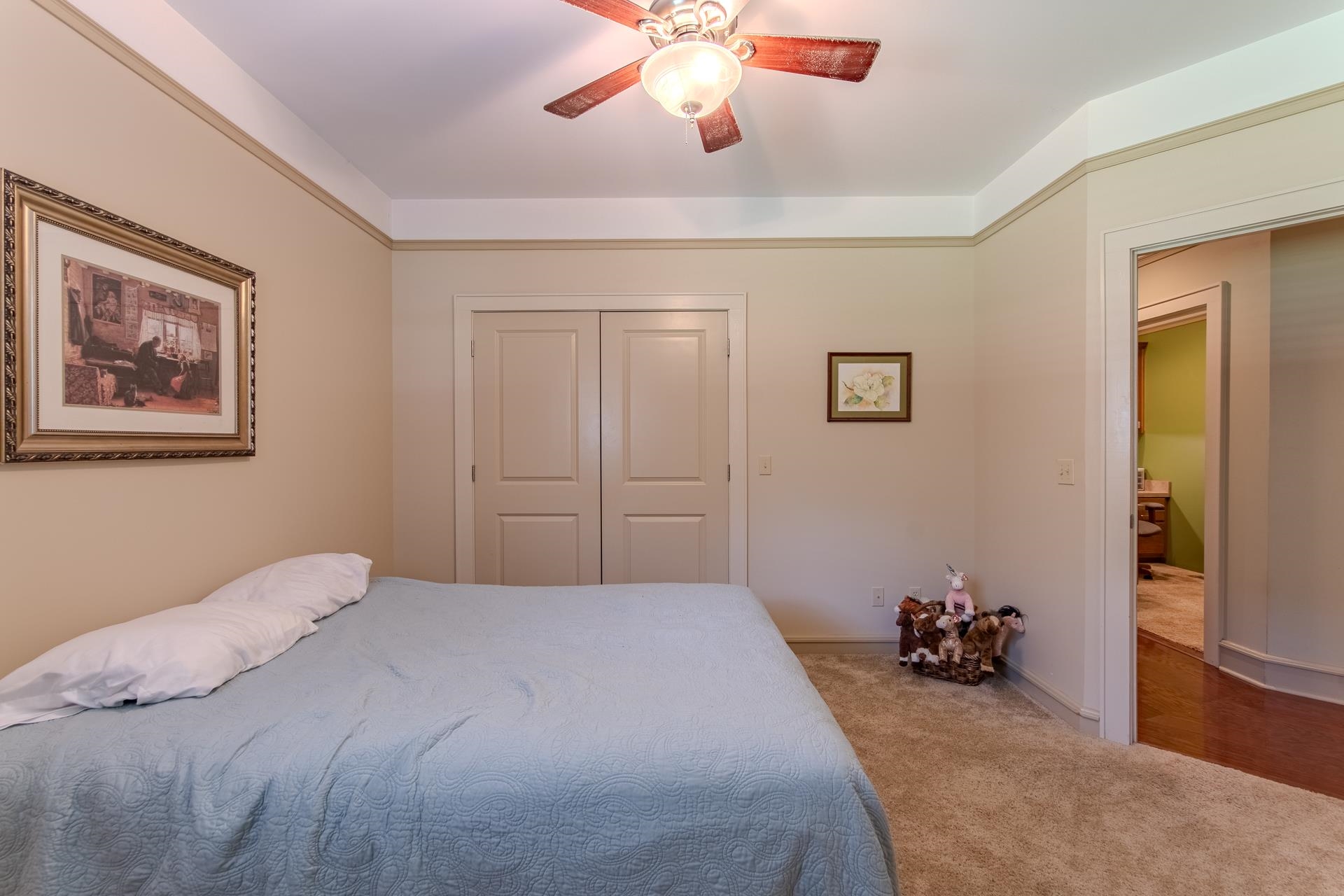 2690 Fellowship Road Sardis, TN 38371 - Photo 29 of 39 a bedroom with a bed and a chandelier