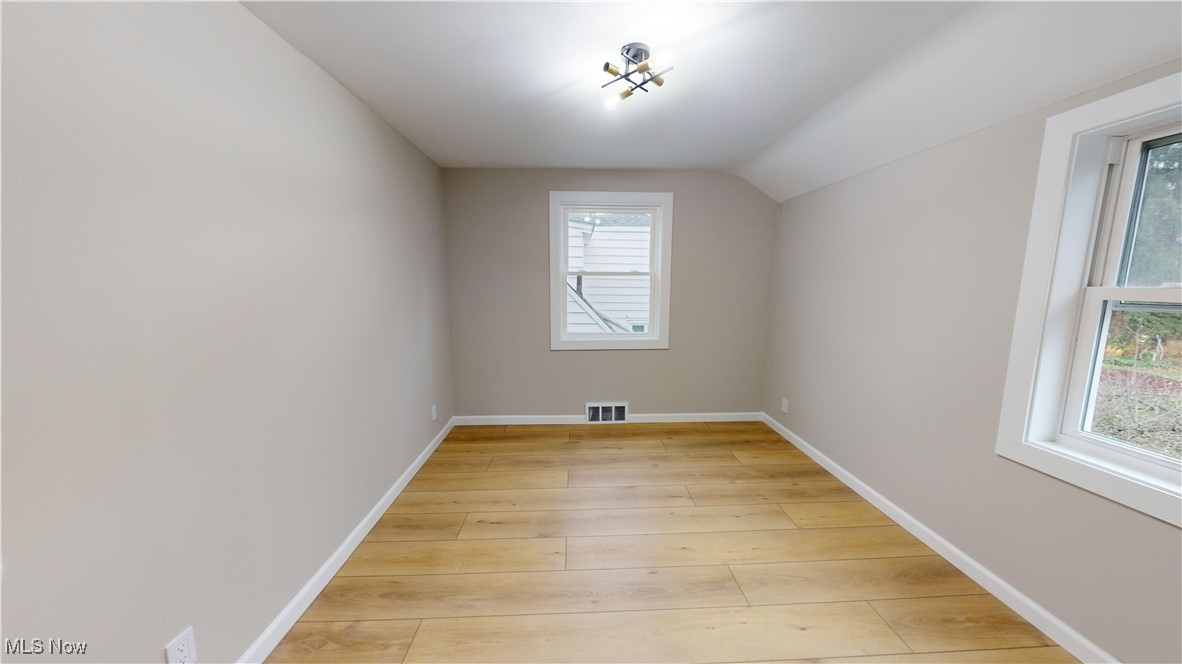 5252 Spencer Road Cleveland, OH 44124 - Photo 16 of 33 Additional living space featuring lofted ceiling and light wood-type flooring