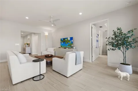 a large kitchen with a table and chairs