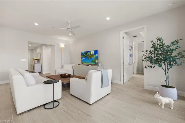 a large kitchen with a table and chairs