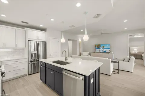 an aerial view of houses with swimming pool