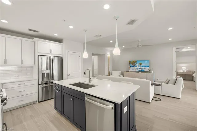 an aerial view of houses with swimming pool