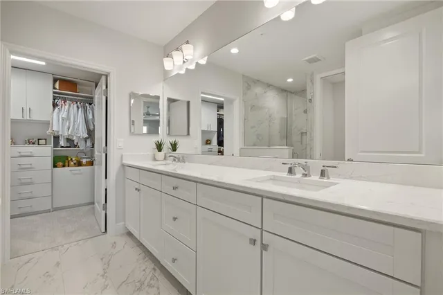 a bedroom with furniture and a chandelier