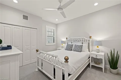 a bathroom with a double vanity sink a mirror and a shower