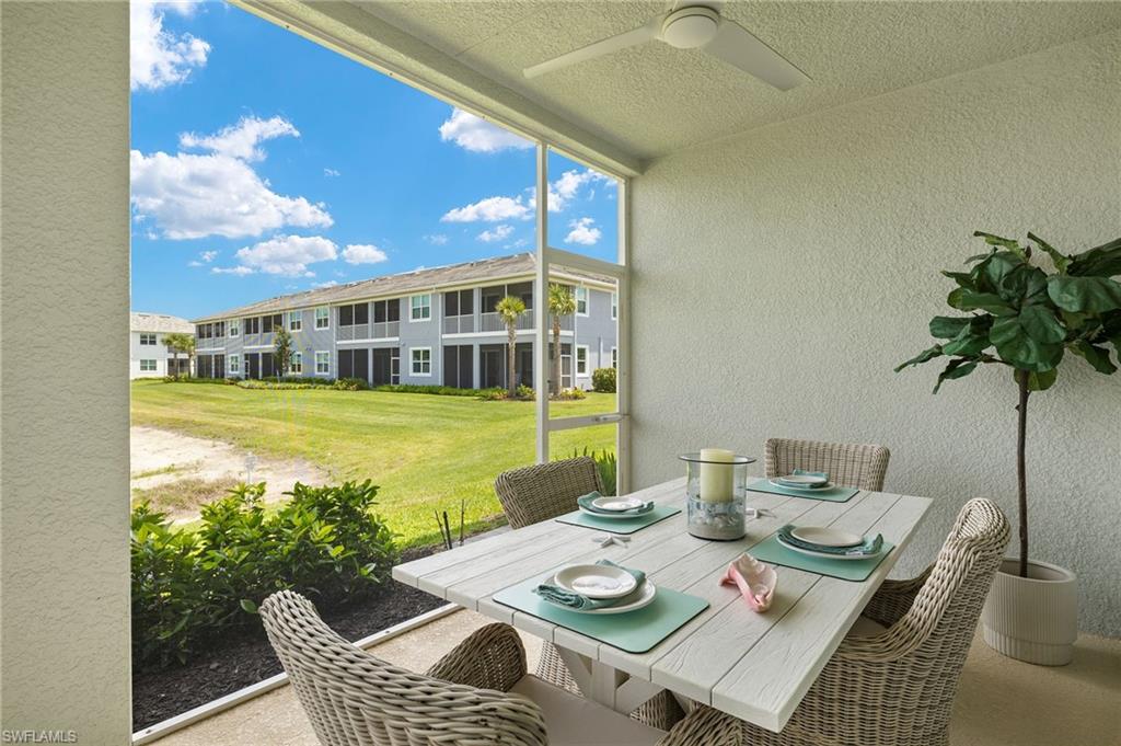2647 Seychelles Circle, Unit 2203 Naples, FL 34112 - Photo 22 of 32 a view of a patio with furniture and a potted plant