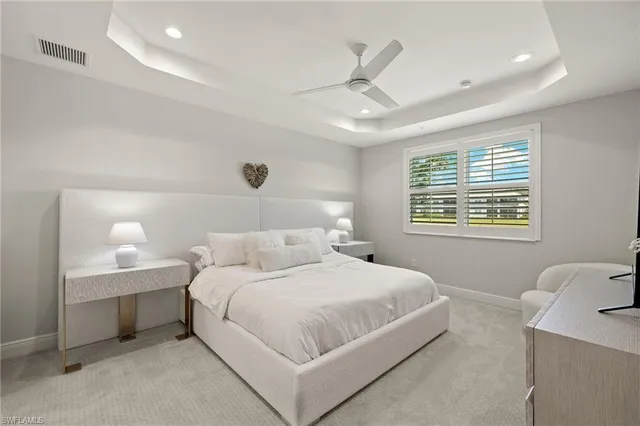 a view of a dining room with furniture wooden floor and a chandelier