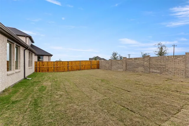 a house with yard in front of it