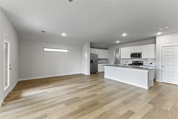 a view of kitchen with wooden floor
