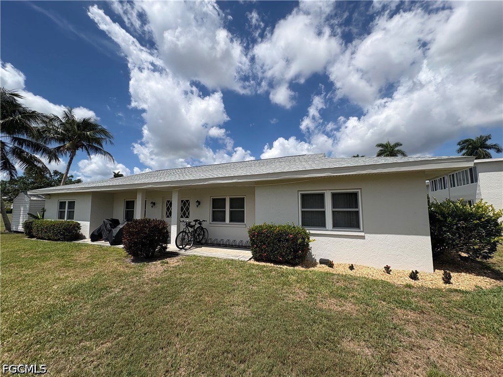 1830 Brantley Road, Unit I7 Fort Myers, FL 33907 - Photo 34 of 34 front view of a house with a patio