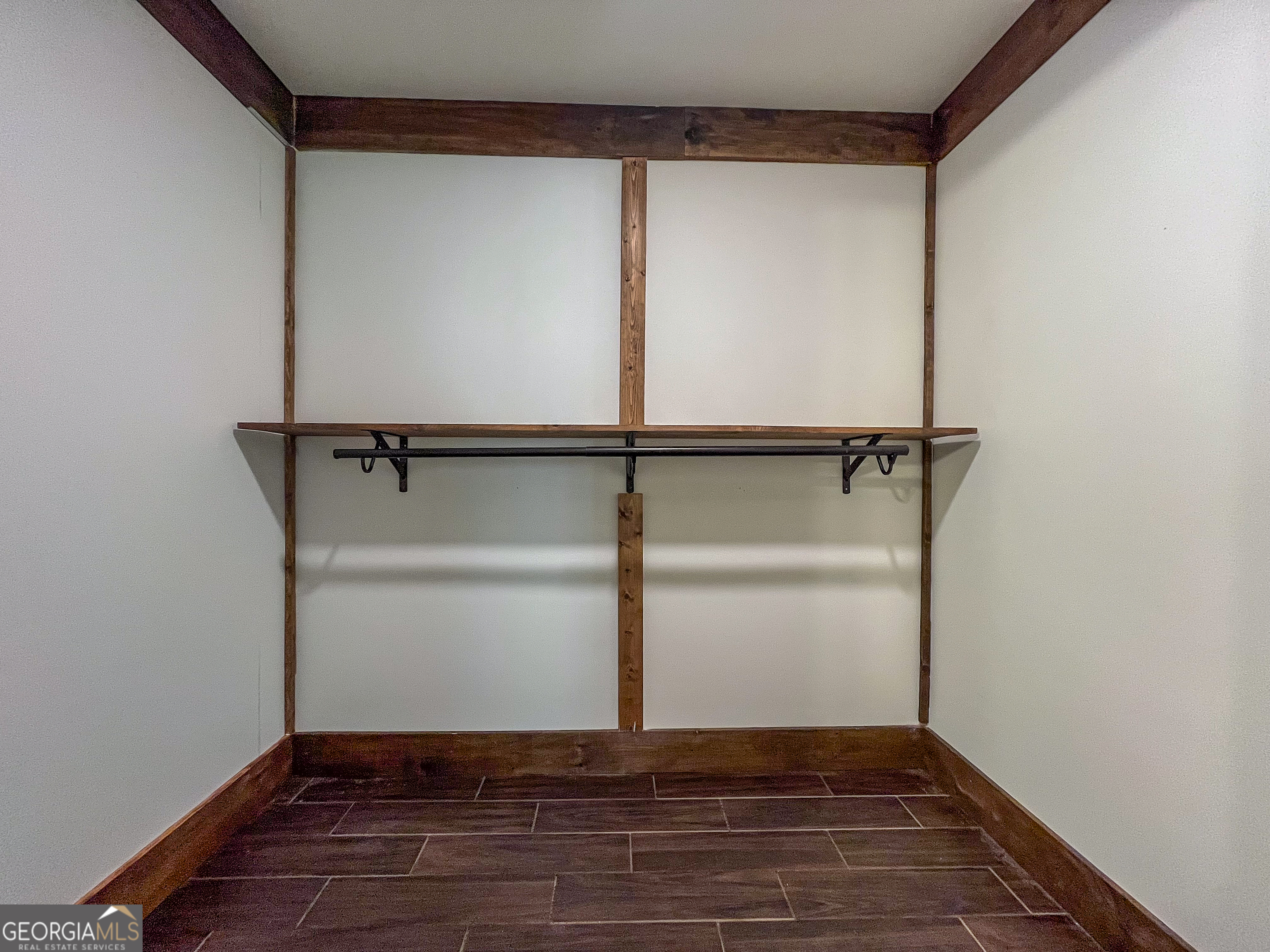 508 Denham Road East Dublin, GA 31027 - Photo 24 of 41 a view of walk in closet with empty racks