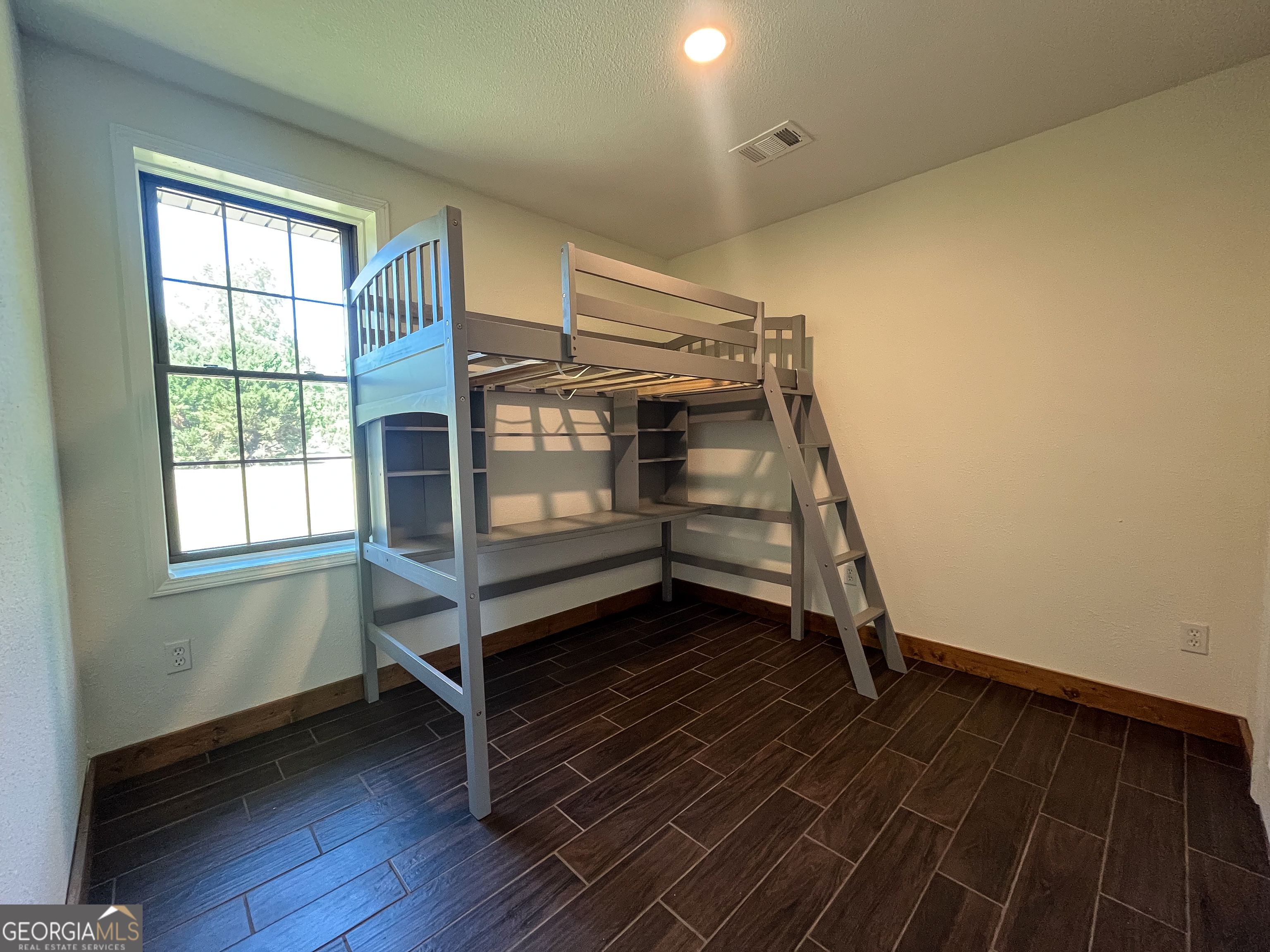 508 Denham Road East Dublin, GA 31027 - Photo 27 of 41 a view of room with window and hardwood floor