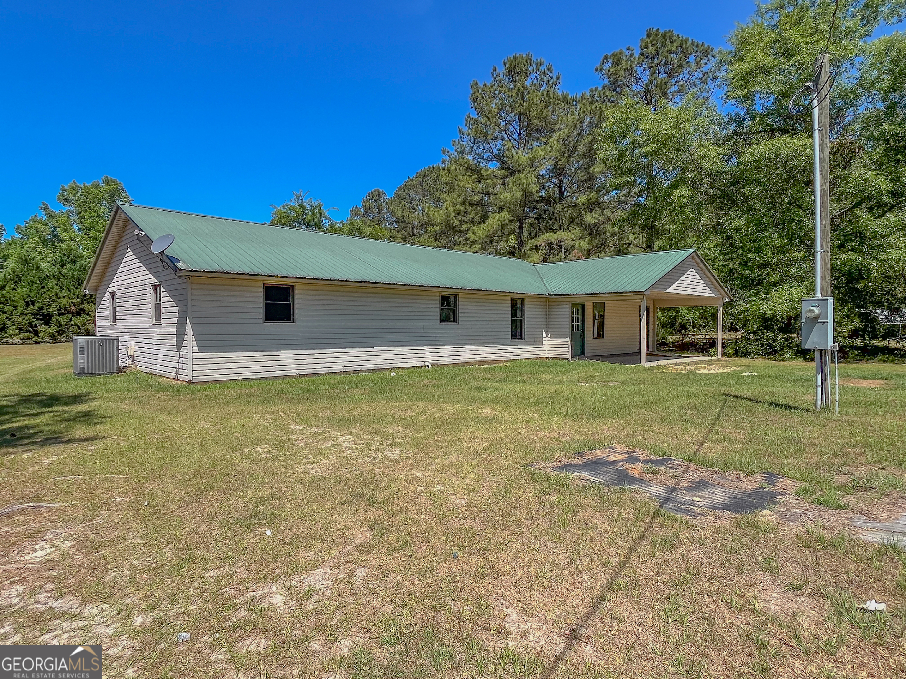 508 Denham Road East Dublin, GA 31027 - Photo 36 of 41 a house with trees in the background