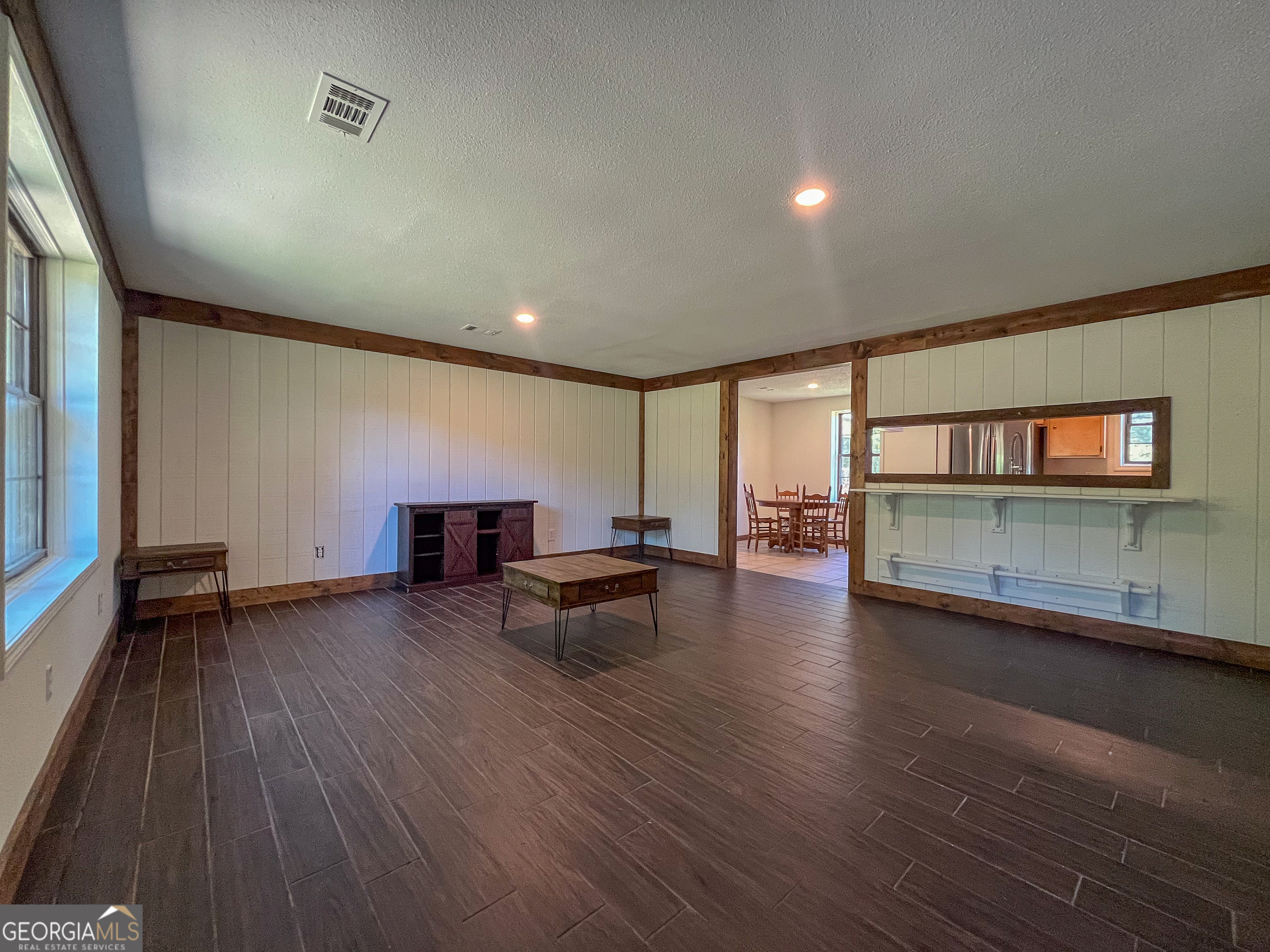 508 Denham Road East Dublin, GA 31027 - Photo 8 of 41 an empty room with wooden floor and windows