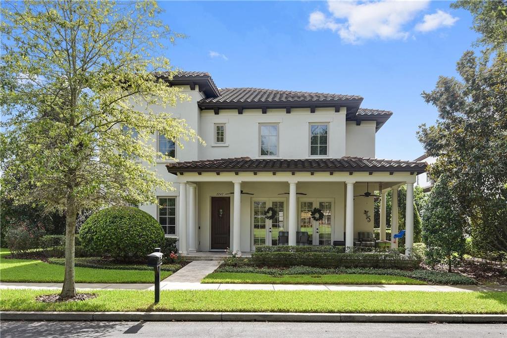 2247 Snow Road Orlando, FL 32814 - Photo 1 of 1 a front view of a house with a yard