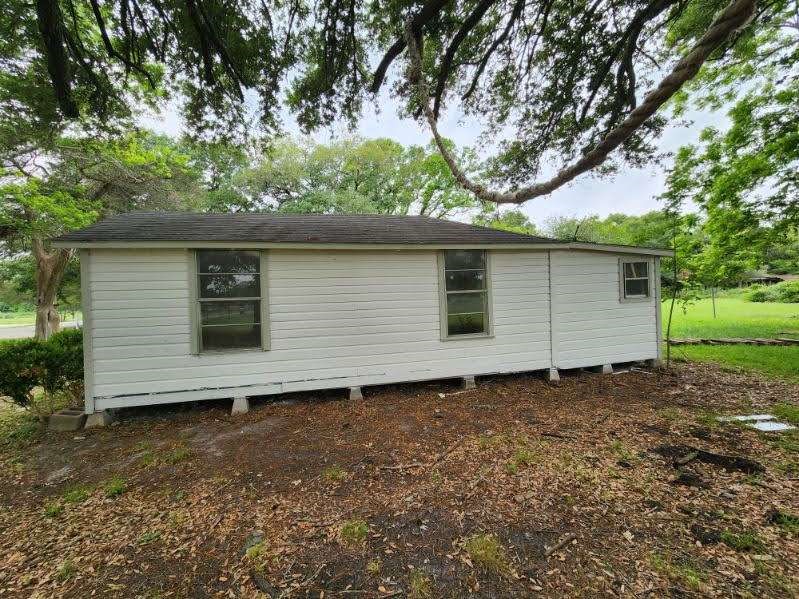 1329 Adams Road Bay City, TX 77414 - Photo 13 of 13 a backyard of a house with lots of green space