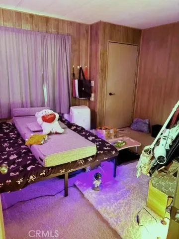 a bedroom with a bed and a table