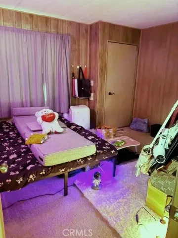 a bedroom with a bed and a table