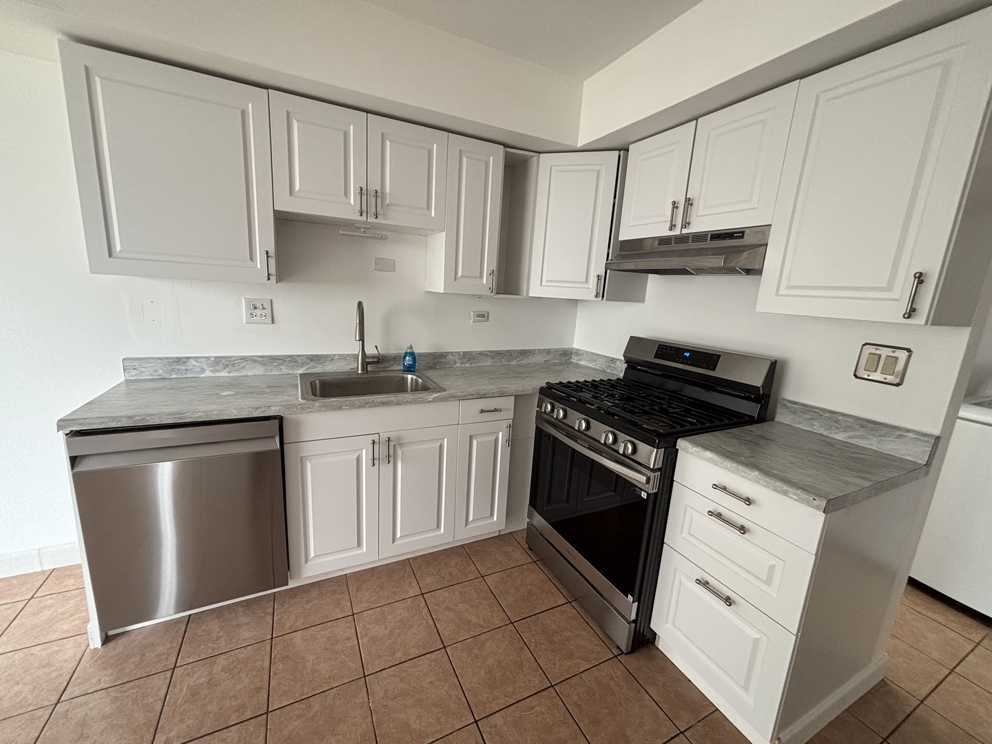 1707 Queensbury Circle Hoffman Estates, IL 60169 - Photo 3 of 10 a kitchen with cabinets appliances and a sink