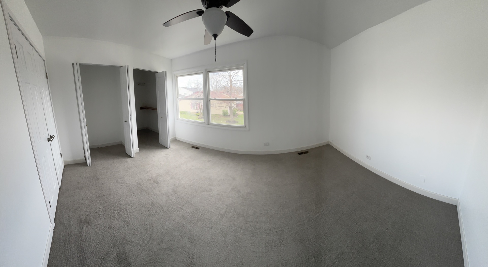 1707 Queensbury Circle Hoffman Estates, IL 60169 - Photo 9 of 10 an empty room with a empty space and windows