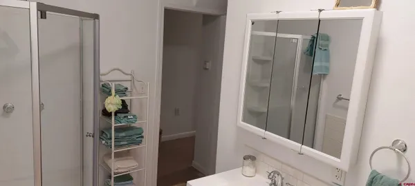 a kitchen with stainless steel appliances a refrigerator and a stove top oven