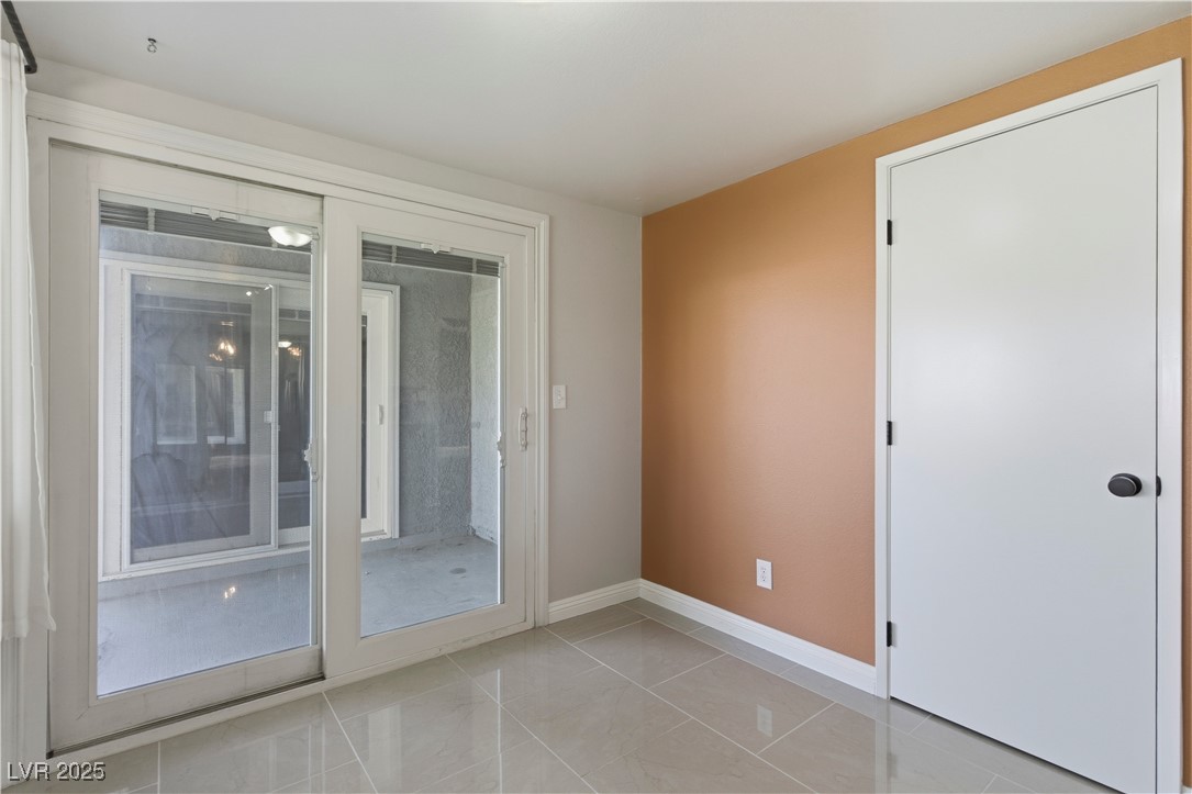 782 Darlene Way Boulder City, NV 89005 - Photo 14 of 39 Spare room featuring baseboards and light tile patterned floors