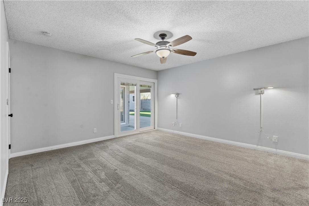 782 Darlene Way Boulder City, NV 89005 - Photo 16 of 39 Carpeted spare room with a textured ceiling and ceiling fan