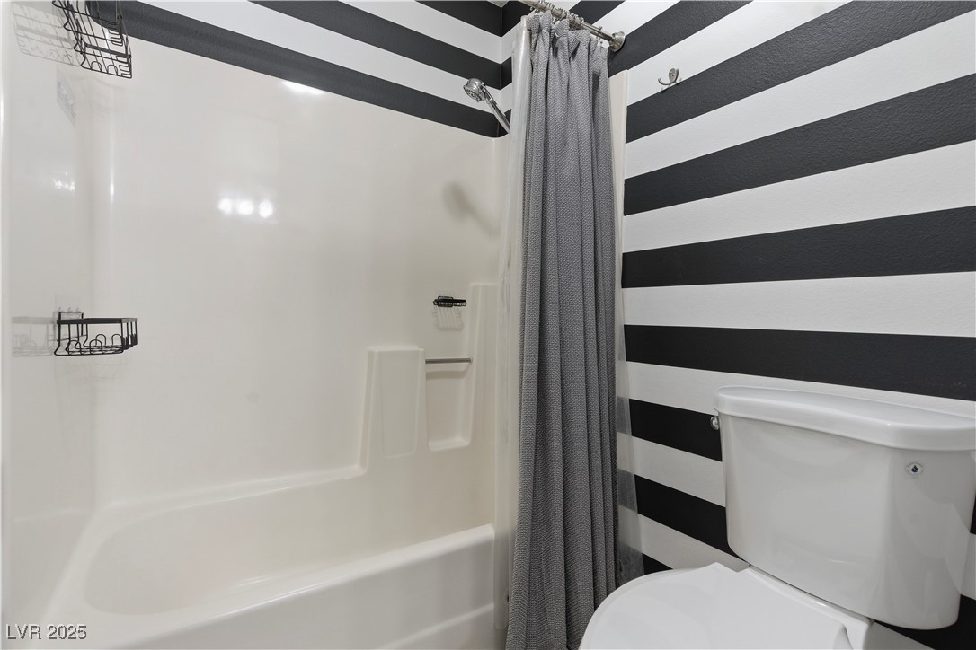 782 Darlene Way Boulder City, NV 89005 - Photo 23 of 39 Full bathroom featuring shower / tub combo with curtain and toilet