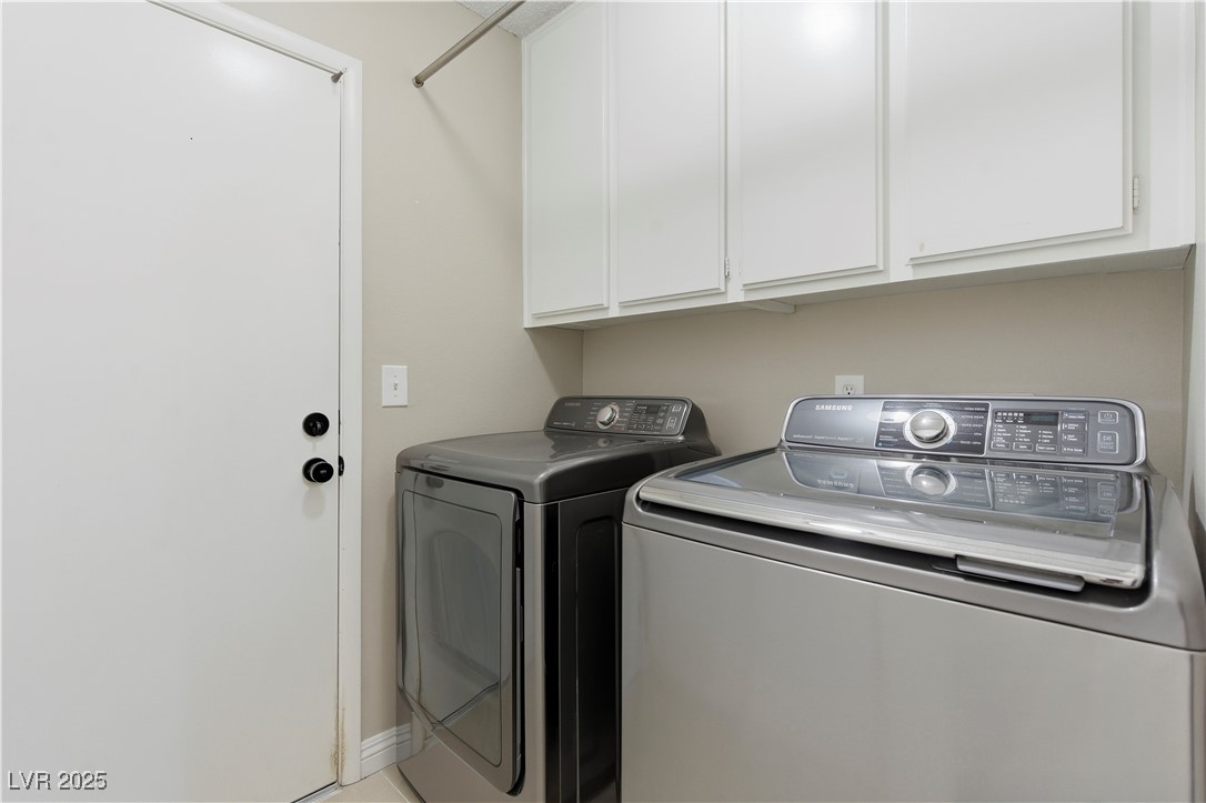 782 Darlene Way Boulder City, NV 89005 - Photo 24 of 39 Laundry room featuring cabinet space and washing machine and clothes dryer