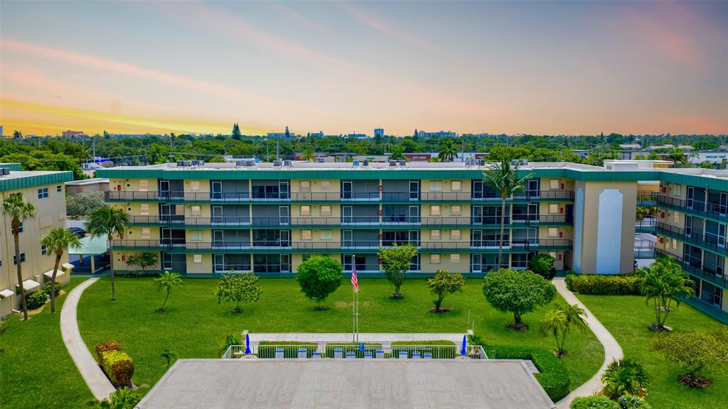 808 Southeast 7th Street, Unit 105B Deerfield Beach, FL 33441 - Photo 1 of 43 a view of a big yard next to a building