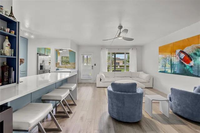 a kitchen with granite countertop a stainless steel stove and refrigerator