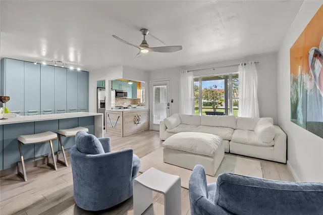 a kitchen with stainless steel appliances a stove sink and cabinets