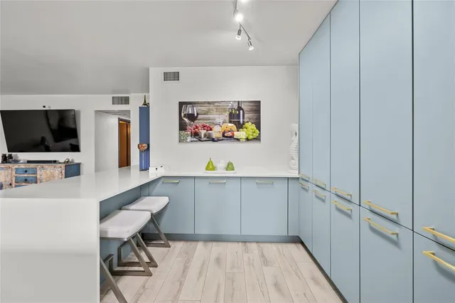 a bedroom with a bed and cabinet