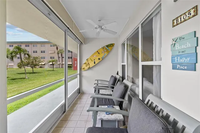 a swimming pool with outdoor seating and yard