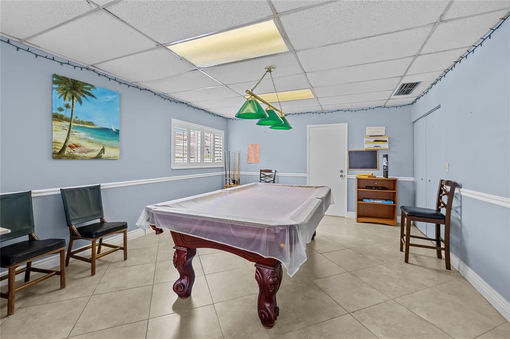 808 Southeast 7th Street, Unit 105B Deerfield Beach, FL 33441 - Photo 33 of 43 a room with furniture and a rug